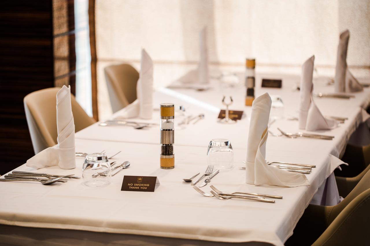 Radisson Hotel Sfax Exteriör bild A table set for a formal meal