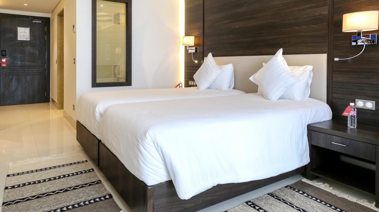 Radisson Hotel Sfax Exteriör bild A bedroom at the hotel